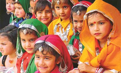 Little girls of St Xavier Playway School wait backstage