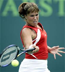 Jennifer Capriati of USA returns a serve to her fellow American Meghann Shaughnessy 