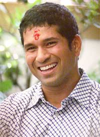 Sporting a saffron smear on his forehead, Sachin Tendulkar announces he will play in a friendly against Sri Lanka