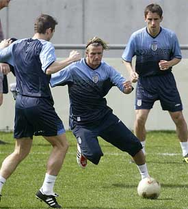 England and Manchester United's David Beckham trains with club-mate Gary Neville and Chelsea's Frank Lampard 