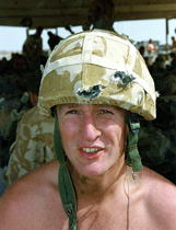 Eric Walderman of British Royal Marine wears the kevlar helmet that saved his life after being hit by four bullets 