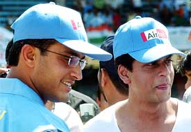 Saurav Ganguly and Bollywood star Shah Rukh Khan chat during a friendly charity cricket match