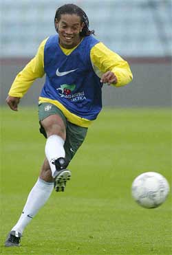Paris Saint-Germain player Ronaldinho Gaucho shoots for goal during a Brazilian national team