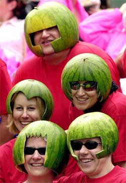 Rugby fans wear watermelon skins during the Hong Kong annual Rugby Sevens Tournament