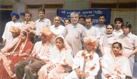 The marriage of three girls, arranged by the Maa Bhagwati Club, being solemnised at Gurdwara Sri Guru Singh Sabha