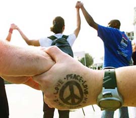 Anti-Iraq war demonstrators hold hands during a protest