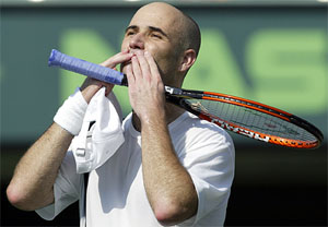 Andre Agassi of the USA blows kisses to the crowd