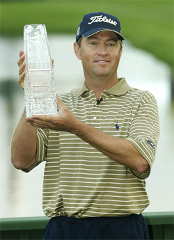 Davis Love III holds his trophy after winning The Players Championship