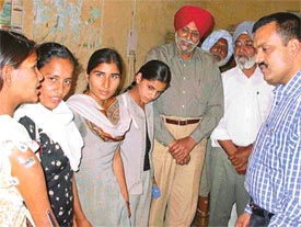 The Deputy Commissioner, Ludhiana, Mr Anurag Agarwal, talks to some of the physically-challenged persons