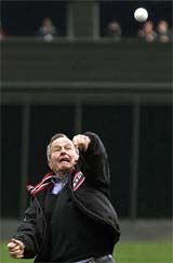Former US President George Herbert Walker Bush throws out the ceremonial first pitch 