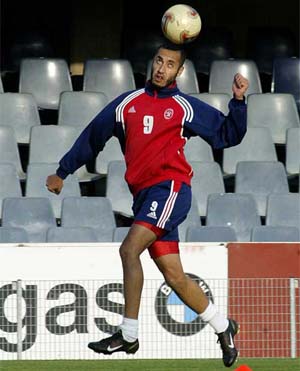 Al-Itthad�s midfielder Al Saadi Gaddafi, son of Libyan President Muammar Gaddafi, jumps for the ball during a training session at Barcelona�s Mini Stadium 