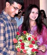 Actress Poonam Dhillon presents a bouquet to Indian captain Saurav Ganguly at a felicitation function