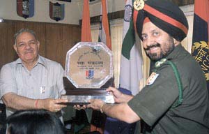 Brig M P S Bajwa, YSM, Deputy Director General, NCC Directorate Kerala, receiving the Rashtra Bhasha trophy from Prof Chaman Lal Gupta