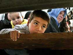 Ayman watches the funeral of his brother Mahmoud Sha�th, killed by Israeli troops at Rafah refugee camp in the southern Gaza Strip on Thursday