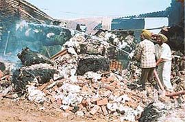 Firemen at work trying to extinguish a fire