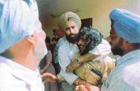 Relatives of the deceased persons being consoled at Bank Colony