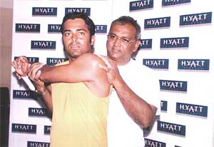 India's ace tennis player Leander Paes is helped by his father Dr Ves Peas