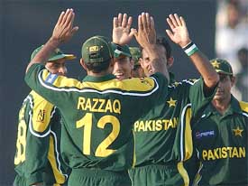 Pakistan team members celebrate after the dismissal of Sri Lanka's Hashan Tillekeratne