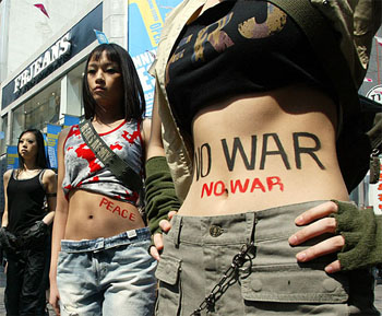 South Korean models pose in outfits of a local clothing maker