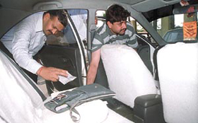 The ill-fated car being examined by investigators.