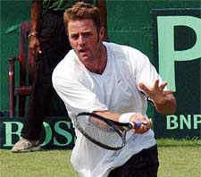 Alistair Hunt of New Zealand in action against India's Rohan Bopanna