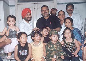 Bonny Babies: Daler Mehendi and MLA Mukesh Sharma with children at the Health Mela organised by Kalra Hospital at Punjabi Bagh on Sunday.