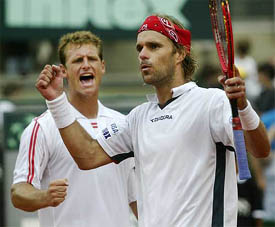 Argentines Lucas Arnold and David Nalbandian celebrate their victory over Russians Yevgeny Kafelnikov and Mikhail Youzhny