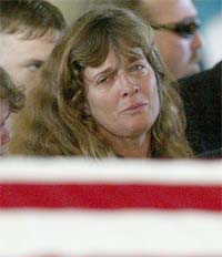 Patty Steve, mother of US Marine Lance Cpl Brian Buesing (20), looks at the American flag