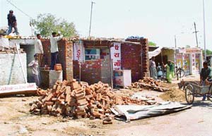 Fresh constructions come up in the illegal Guru Nanak Colony on the Chandigarh -SAS Nagar border.