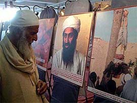 An old man takes a look at the photos