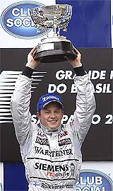 McLaren Formula One driver Kimi Raikkonen celebrates after winning the Brazilian Grand Prix