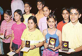 Winners of Kipkids Genius Award (B) category with their prizes at Tagore Theatre 