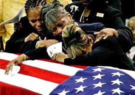 Patricia Webb .mother of US Army Specialist Jamaal Addison, mourns along with other family members during his funeral at White's Chapel United Methodist Church