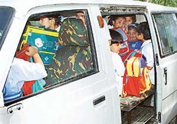 Guess how many students are there in this van? In a classic case of overloading