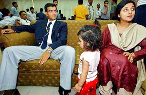 Indian captain Sourav Ganguly along with his wife Dona and daughter Sana sit at the Zia International Airport in Dhaka 