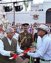 The scion of Chandel family, Kanwar Mohan Singh Chandel, presents a sword as a mark of respect to the Himachal Governor, Mr Suraj Bhan, after the latter inaugurated the first heritage hotel in Haryana, The Fort at Ramgarh, near Panchkula