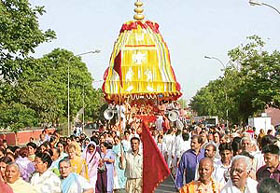 Devotees pull the chariot of Lord Rama during a sankirtan procession, organised by Sri Gaudiya Math