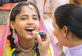 A participant gets ready to take part in a function at Punjabi Bhavan, Ludhiana