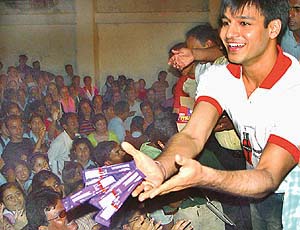 Bollywood star Vivek Oberoi distributes chocolates among students of St Stephen�s School, Sector 45