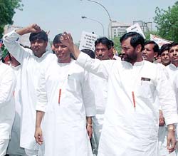 Lok Jan Shakti party chief Ram Vilas Paswan leads party workers during a demonstration against US President George Bush