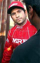Master batsman Sachin Tendulkar reacts during a news conference to announce the forthcoming national Karting championship