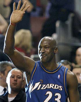 Washington Wizards' Michael Jordan waves goodbye after scoring the final point of his career against the Philadelphia 76ers