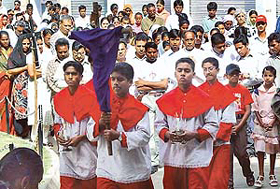 Devotees enact the Stations of The Cross at the Sector 19 cathedral in Chandigarh.