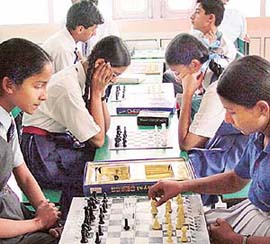 Participants engrossed in making moves in the ICSE chess meet at Tender Heart School