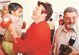 Erika and Karl Heinz Pruemm from Germany share some moments with a child 