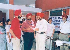 Dr G.S. Kochhar, president, Rotary Chandigarh Shivalik, explains about the health check-up camp