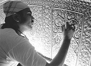 The work of gilding in progress at the Golden Temple despite opposition by some experts