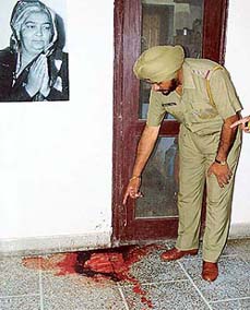 Policeman inspects the crime scene in Ambala city