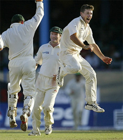 Australia's Brad Hogg celebrates after he bowled West Indies' Brian Lara on the second day of the second Test