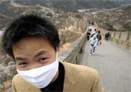 A Chinese tourist wears a mask